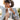 Smiling woman with headphones holding travel tumbler
