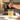 Stirring chicken bone broth in glass on kitchen counter